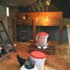 Heated base for poultry chicken drinker by AxiaTool, designed for winter use in garden settings.