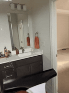 AxiaTool electric cordless window vacuum cleaner with sleek design and ergonomic handle for easy window cleaning.